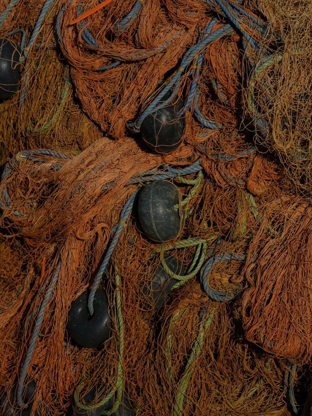 a pile of fishing nets with shoes on them