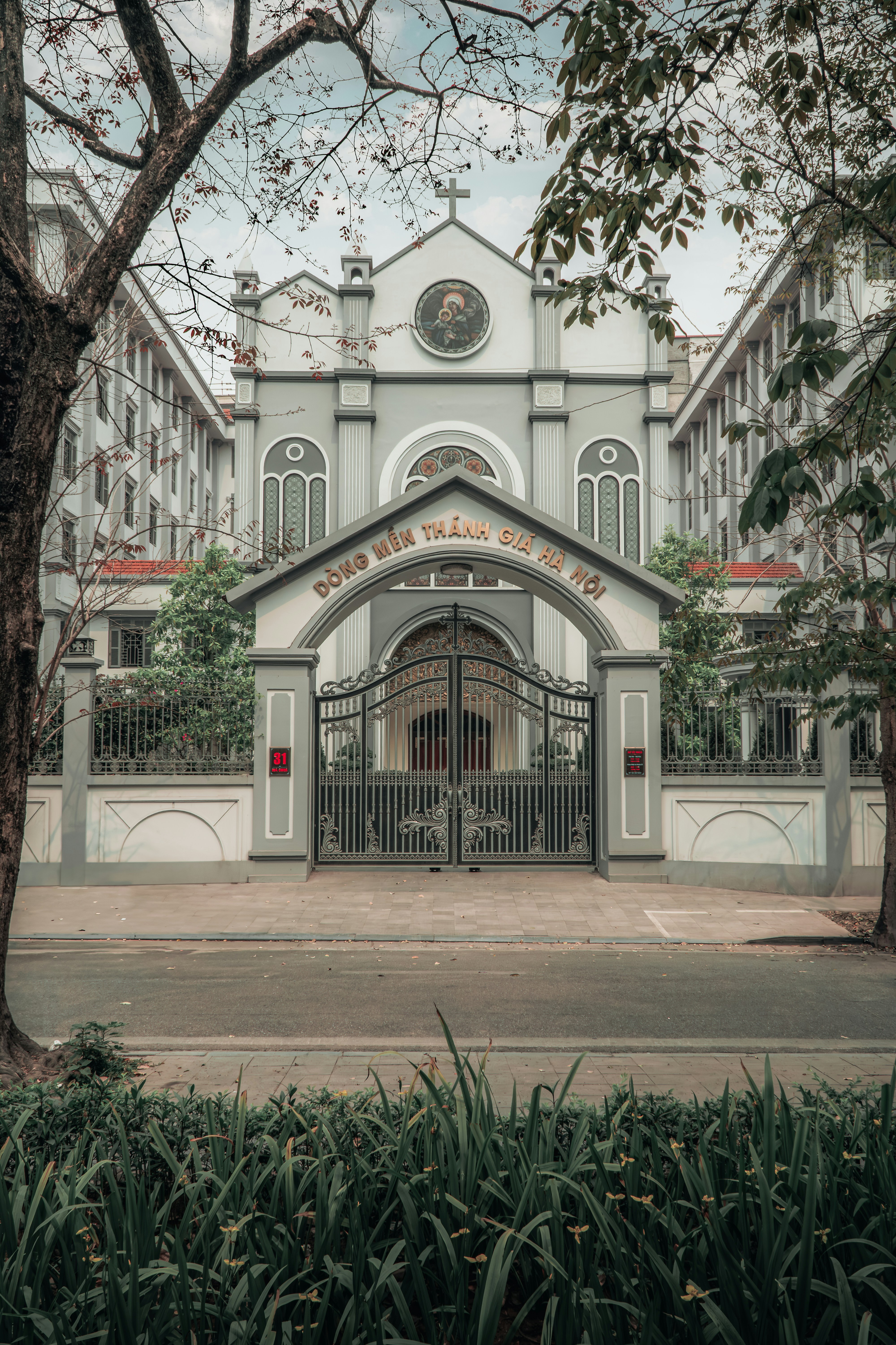 a large white building with a clock on the front of it