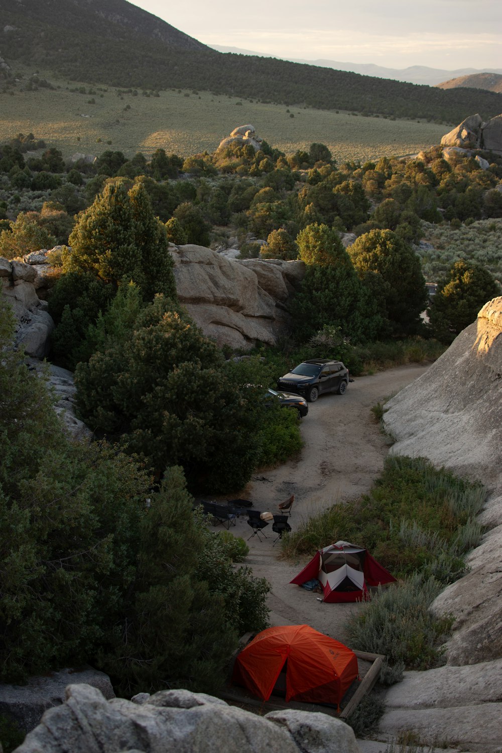 a tent set up on a rocky outcropping