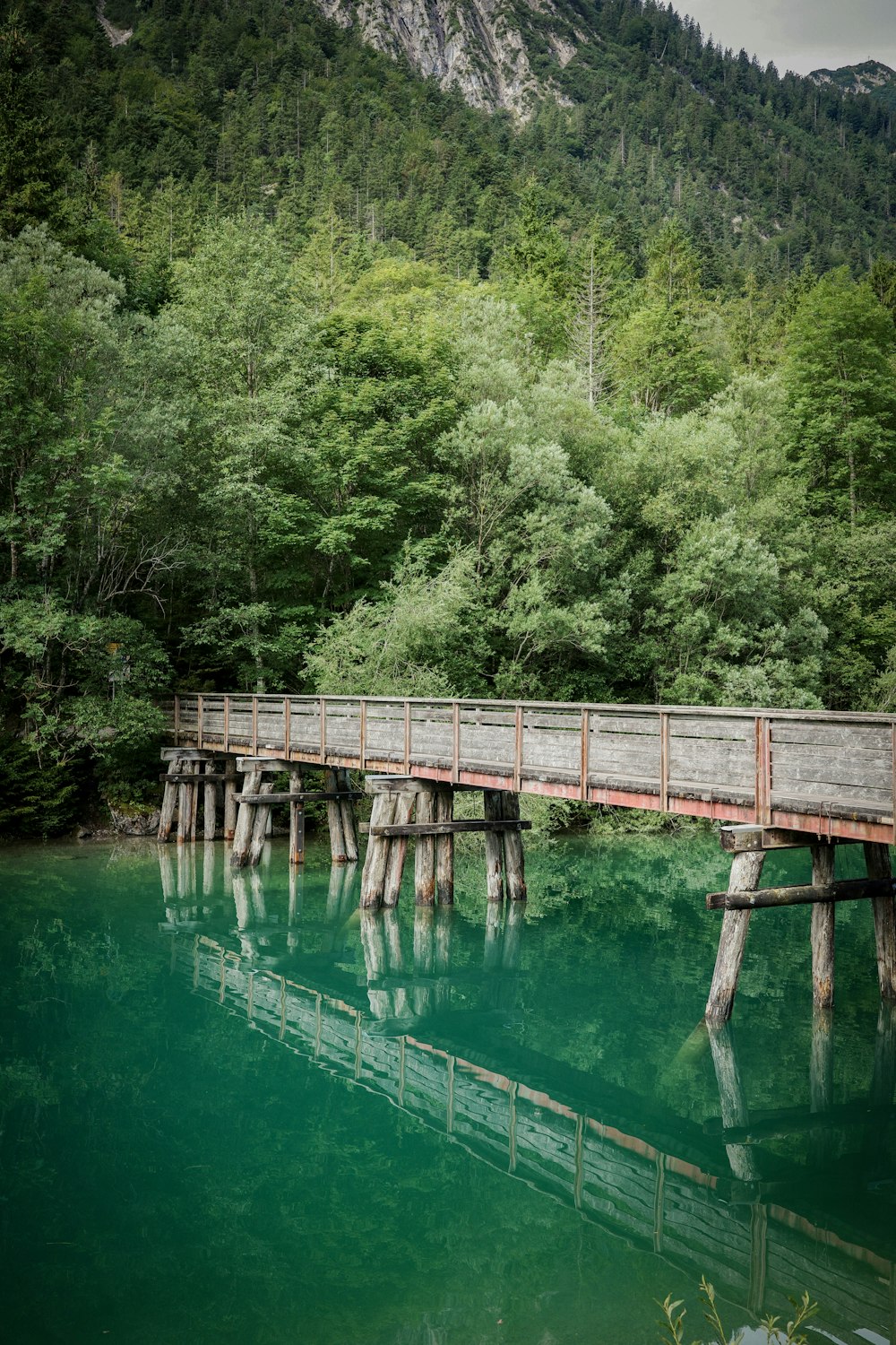 a wooden bridge over a body of water