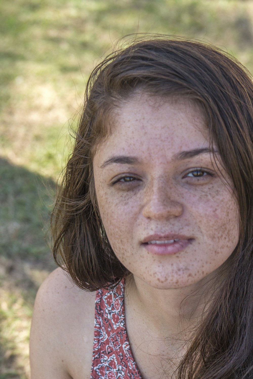a woman with freckles on her face and freckles on her hair