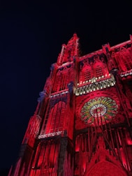 a very tall building with a clock on it's side