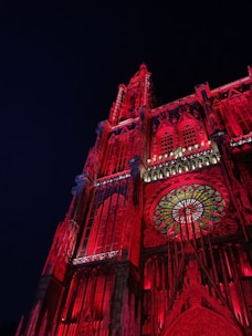 a very tall building with a clock on it's side