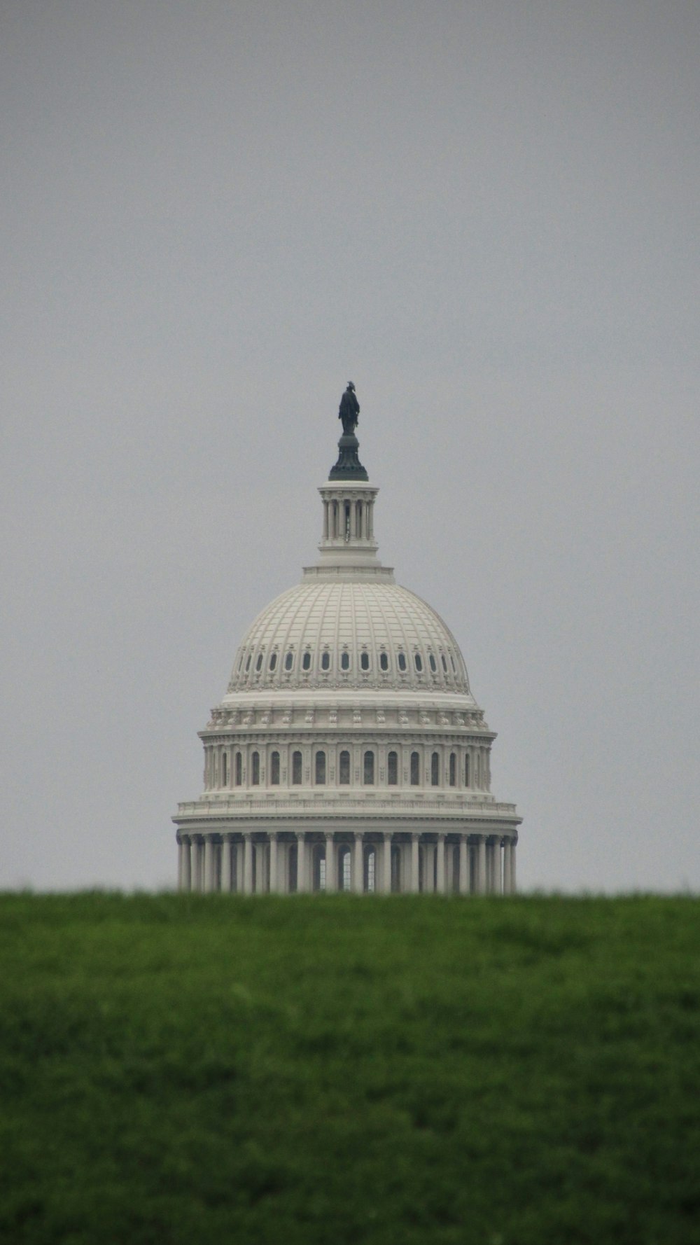 a view of the u s capitol building from across the field