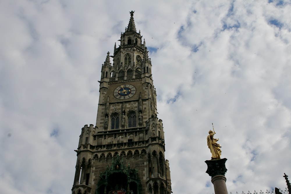 a tall tower with a clock on the top of it