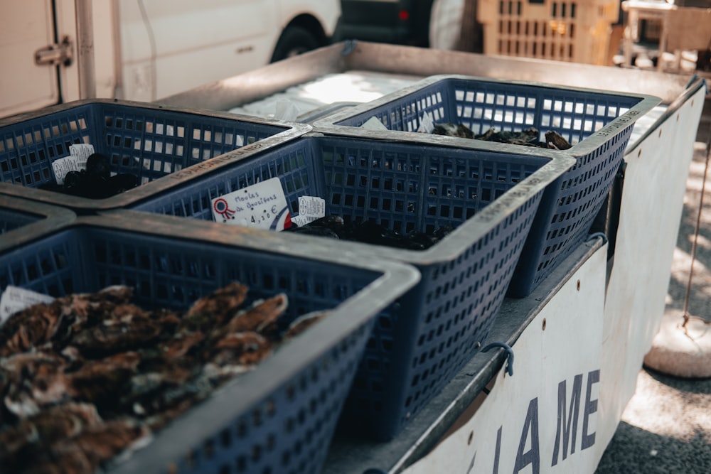 a group of blue baskets sitting on top of a table