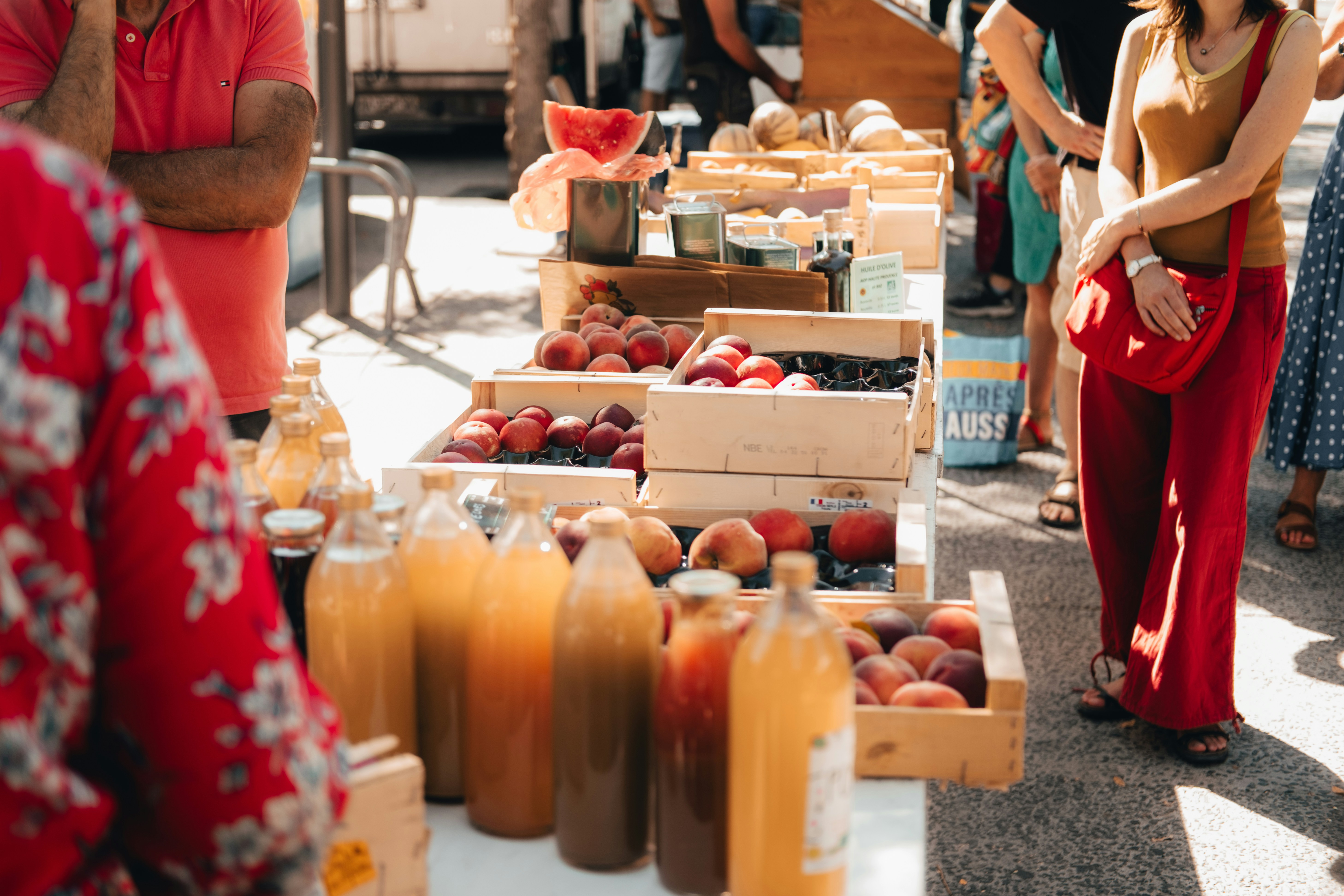A vibrant scene of fresh fruits, water, and a person jogging outdoors.