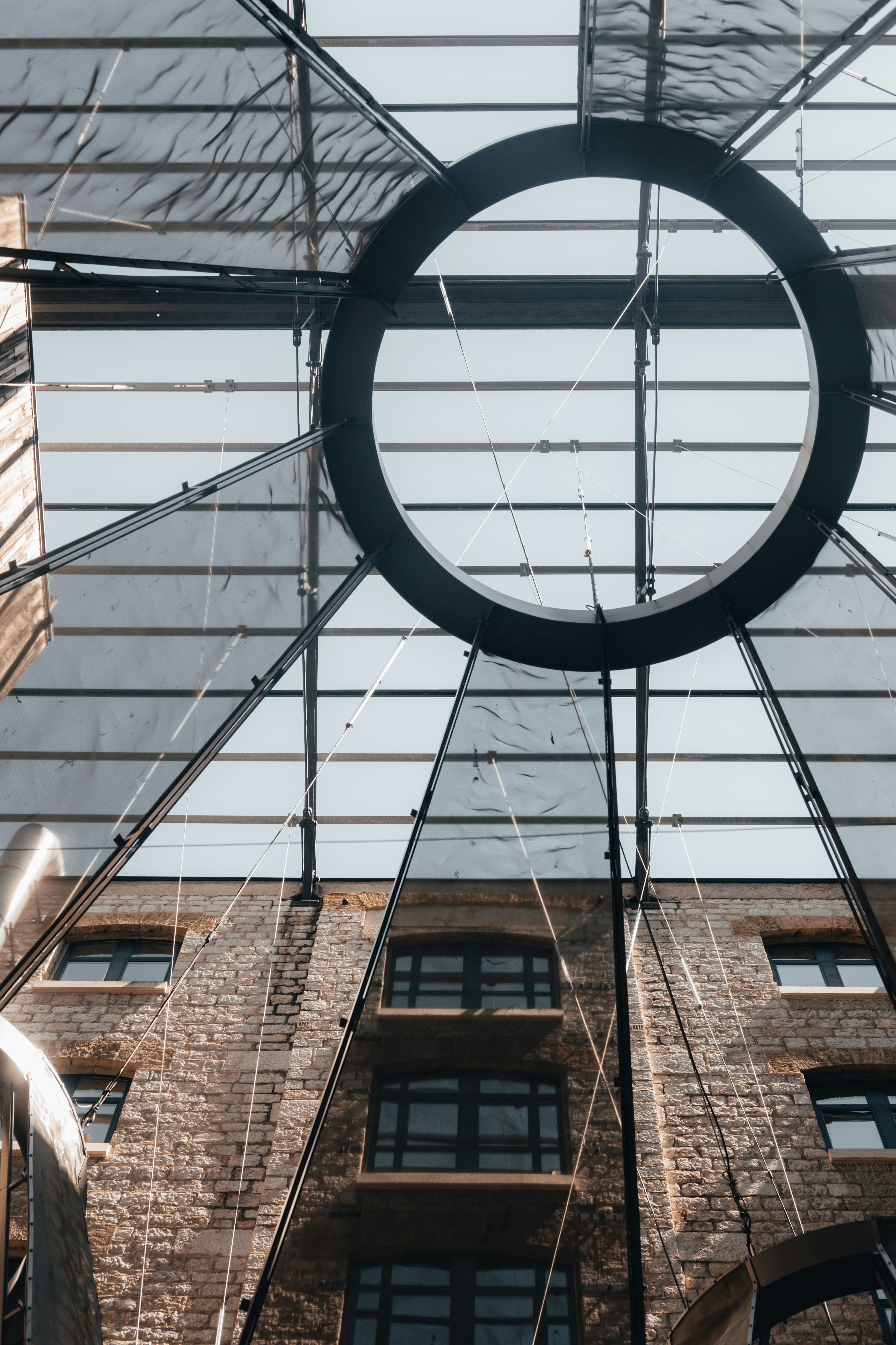 a circular object hanging from the ceiling of a building