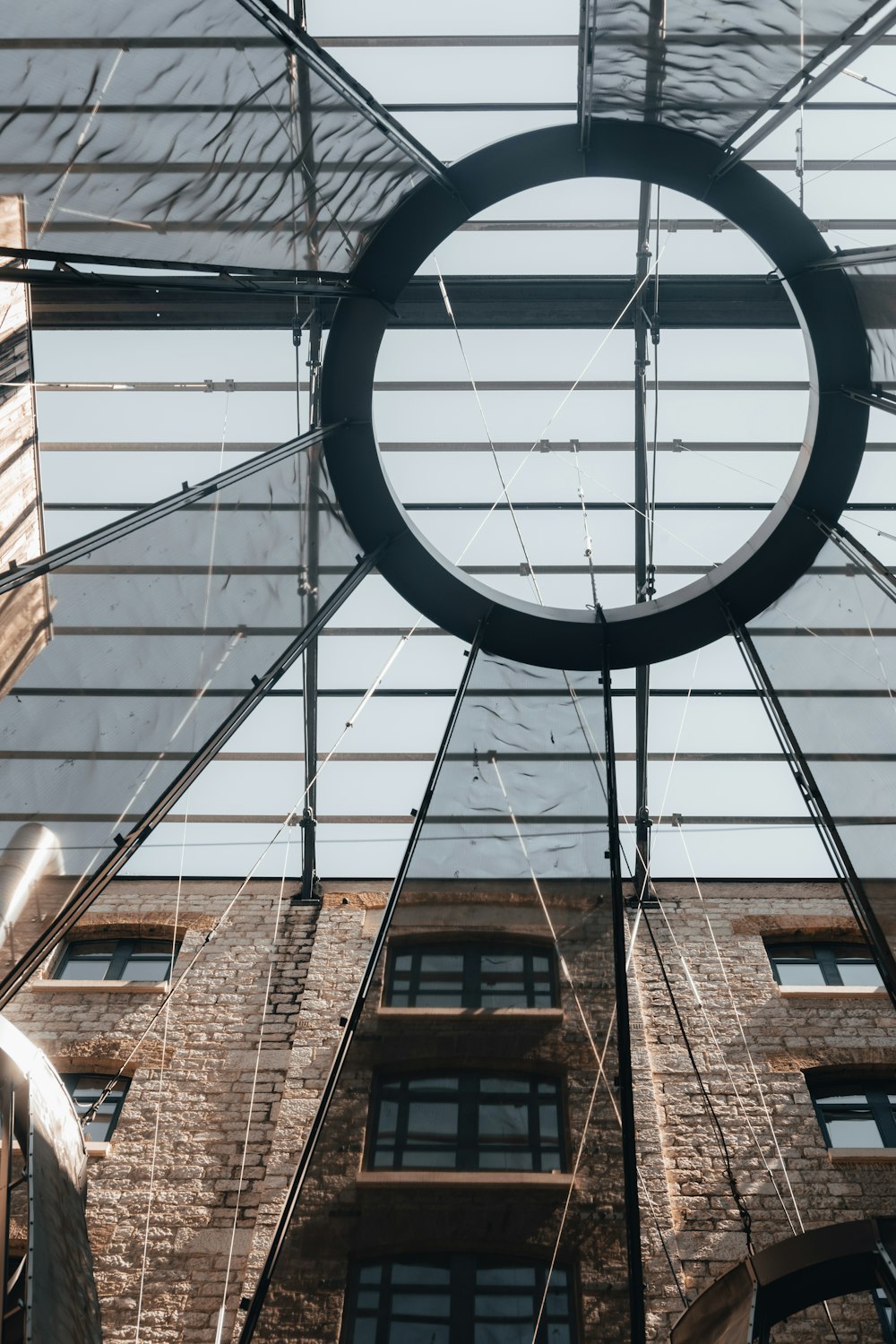 a circular object hanging from the ceiling of a building