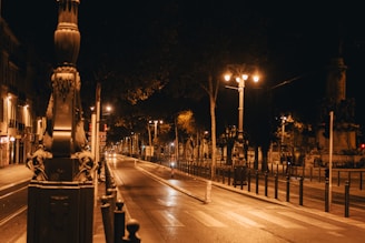 a city street at night with street lights