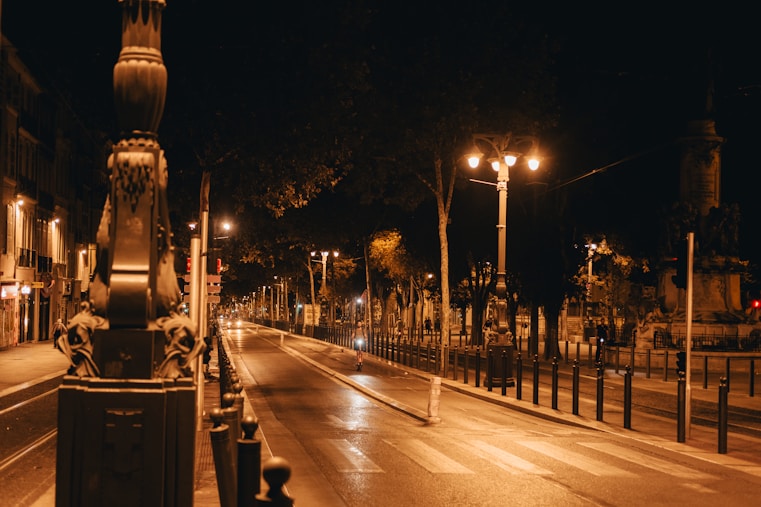 a city street at night with street lights