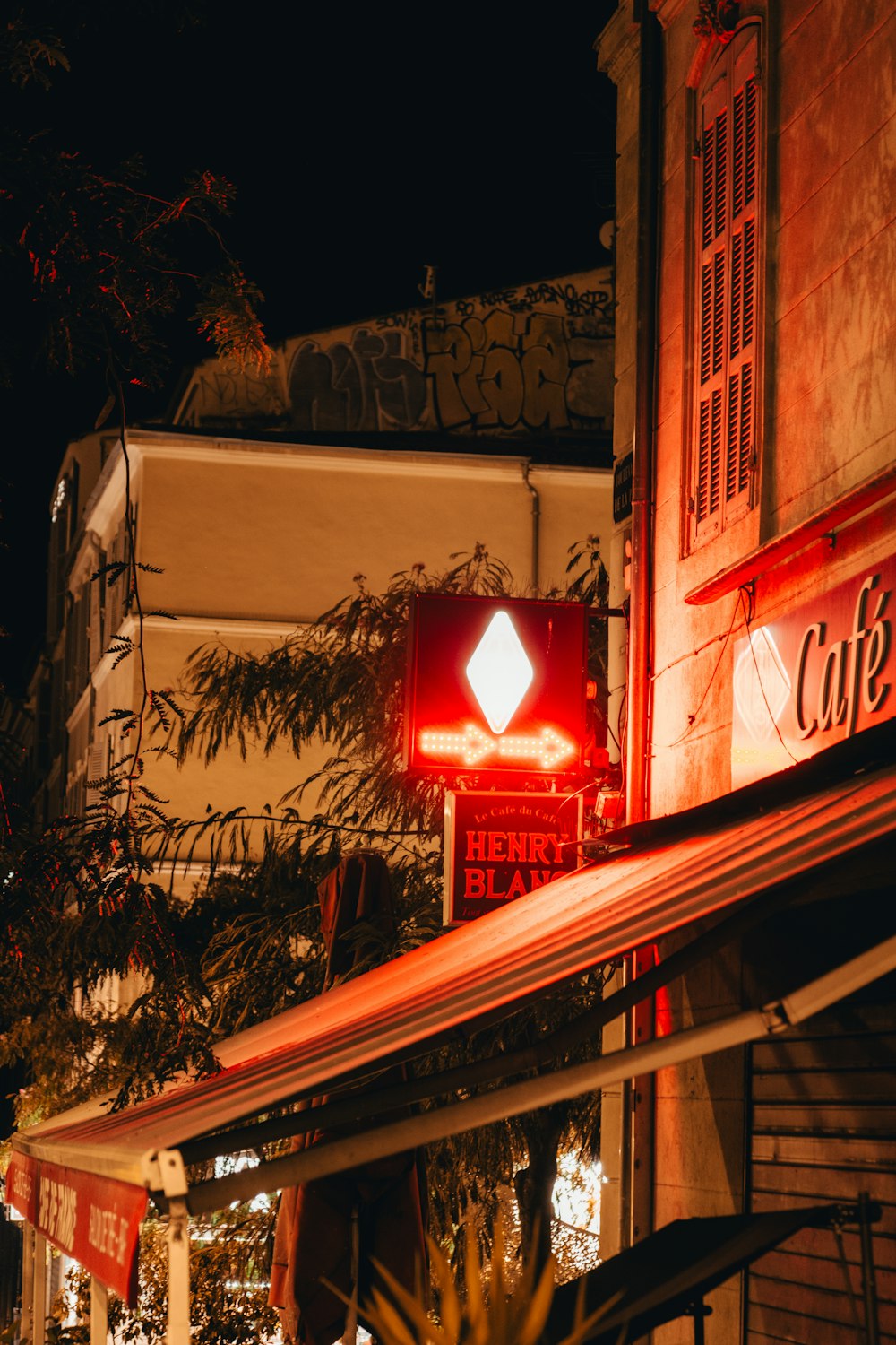 a building with a red light in the middle of it