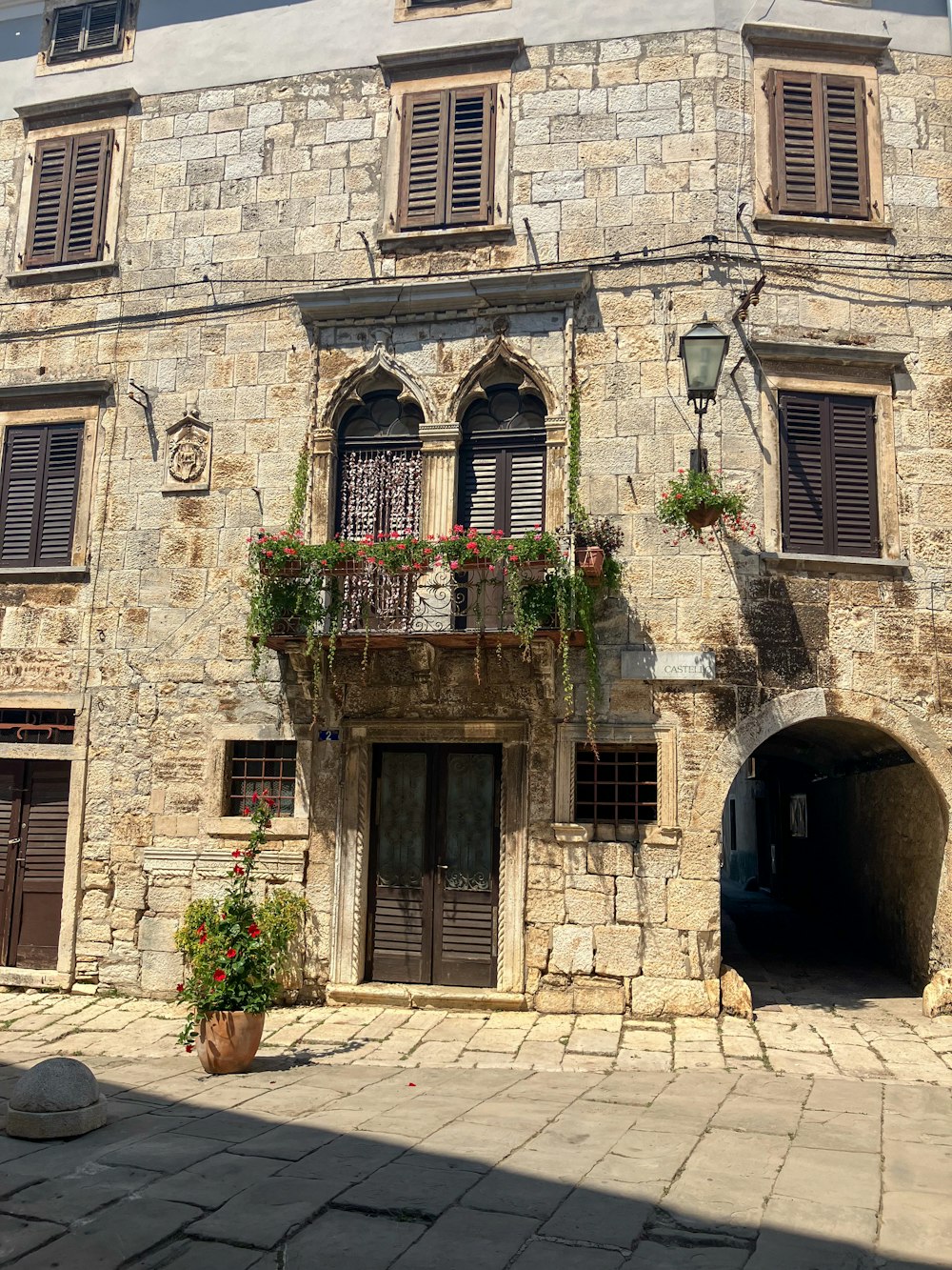 a stone building with a bunch of windows