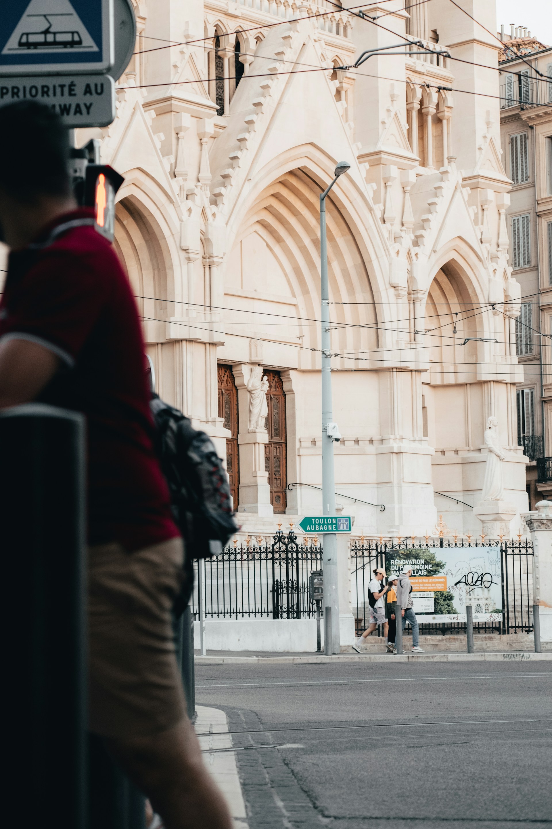 woman wearing yellow long-sleeved dress under white clouds and blue sky during daytime