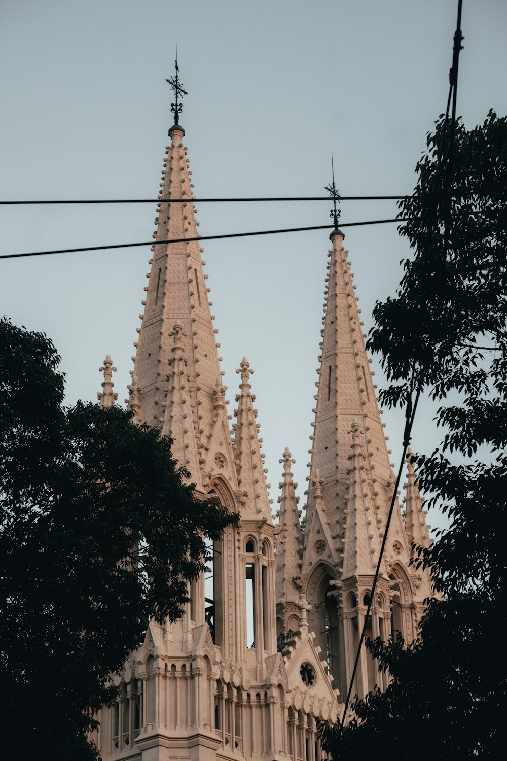 a large cathedral with a clock on it's side