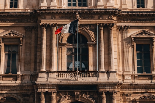 a large building with a flag on top of it