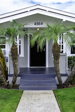A renovated residential property with a welcoming front porch.