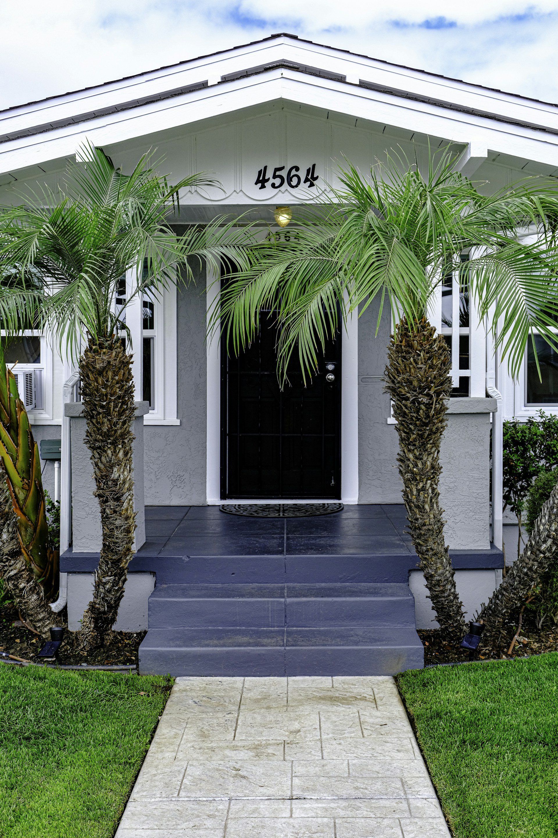 woman wearing yellow long-sleeved dress under white clouds and blue sky during daytime