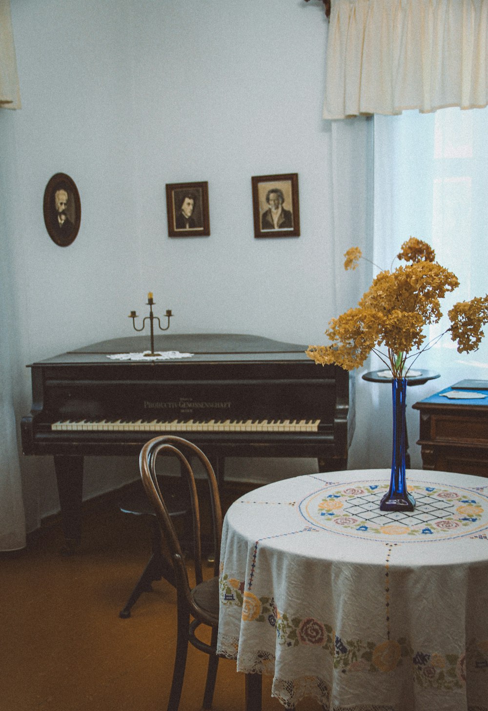 a table with a vase of flowers on top of it