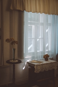 A quiet room arranged with meaningful personal items and flowers.