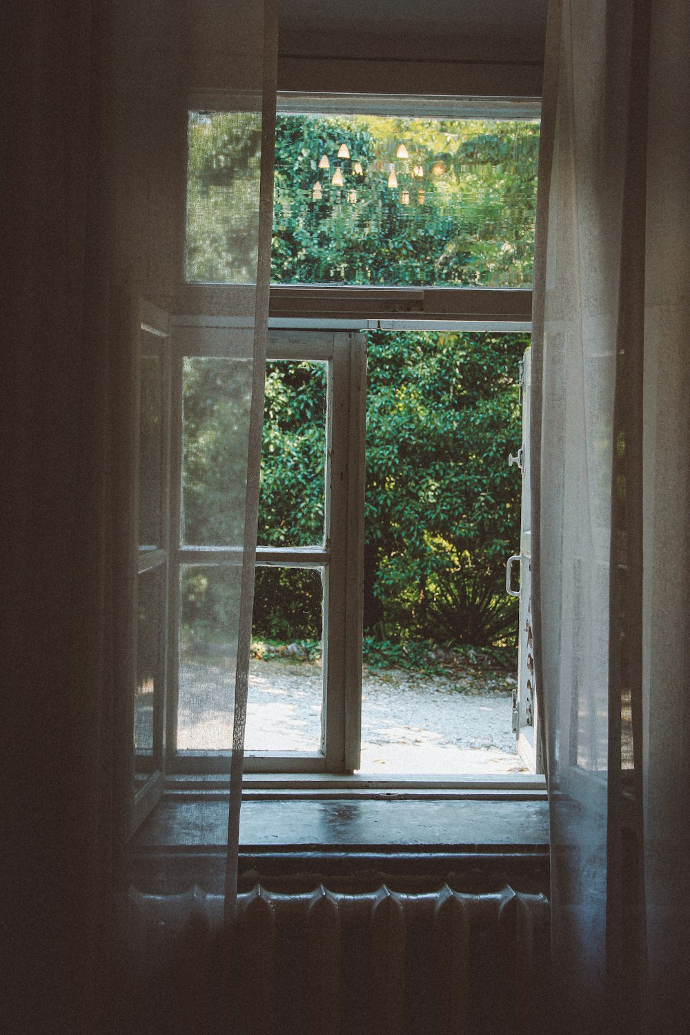 an open window with a ladder in front of it