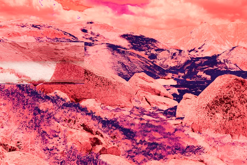 a red and pink photo of a mountain range