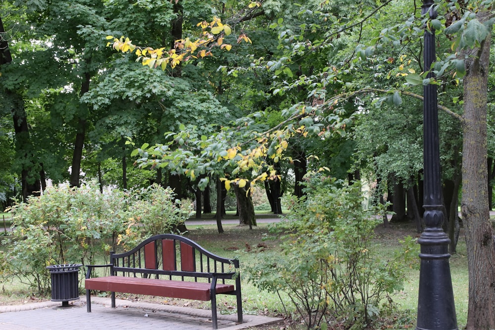 a park bench sitting next to a lamp post