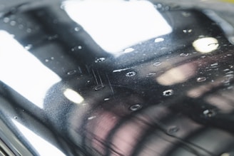 Close-up image of a glossy porcelain tub surface with water droplets showing resistance to stains and wear.