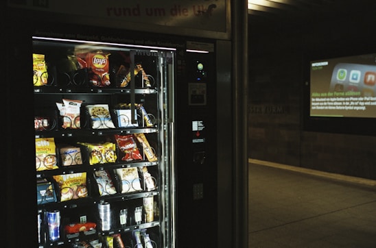 A modern micro market with vending machines and snacks.