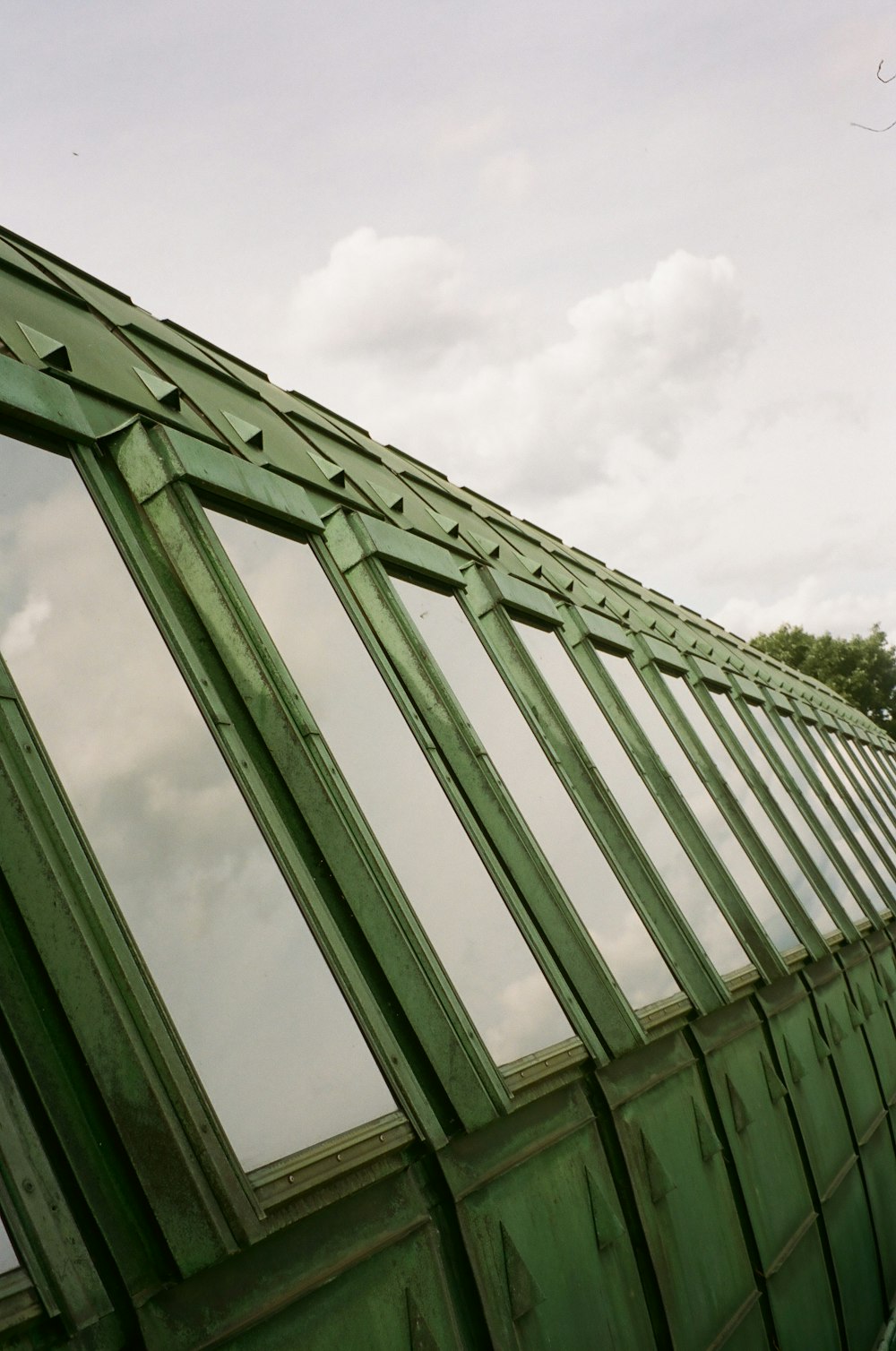 a green building with a lot of windows