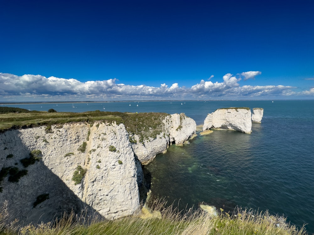 a large body of water surrounded by white cliffs