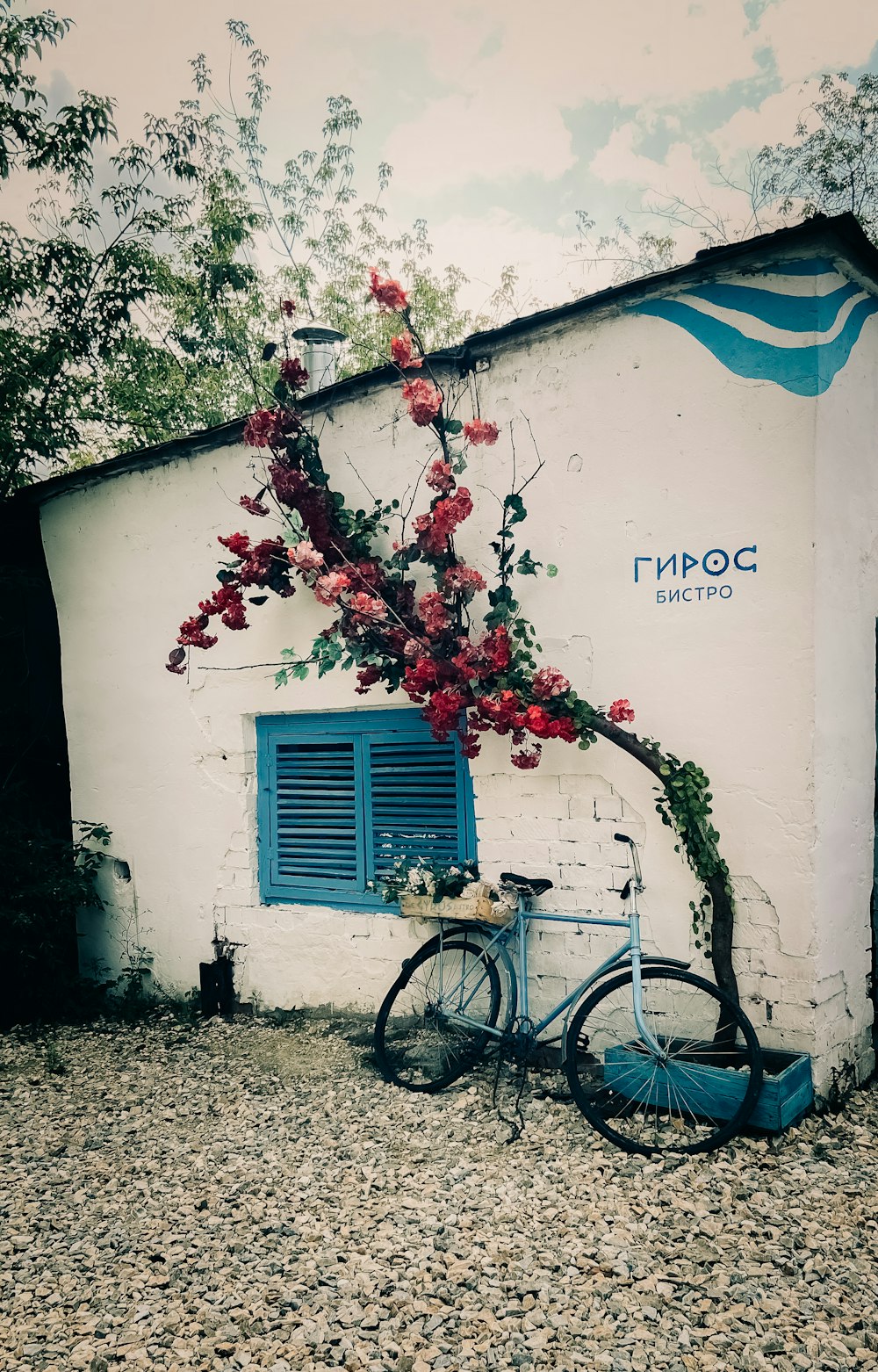 a bike parked next to a white building