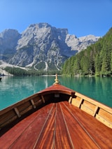 Close-up of a classic wooden yacht cutting through Bear Lake’s clear blue waters.