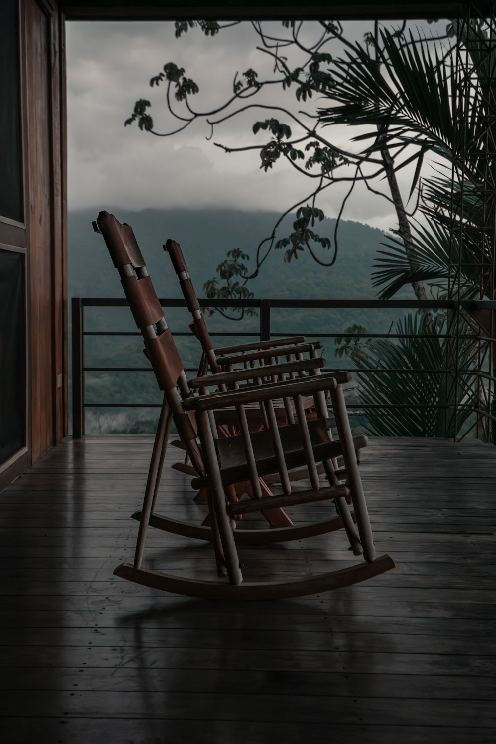 a rocking chair sitting on a wooden porch