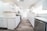 A beautifully renovated kitchen with modern appliances and bright lighting.