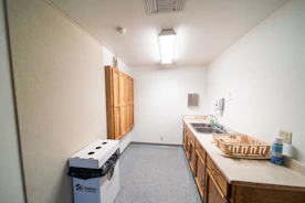 a kitchen with a sink and a refrigerator