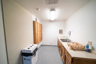 a kitchen with a sink and a refrigerator