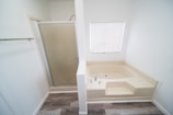 Before and after of bathtub replaced by modern shower tray in an Alicante bathroom