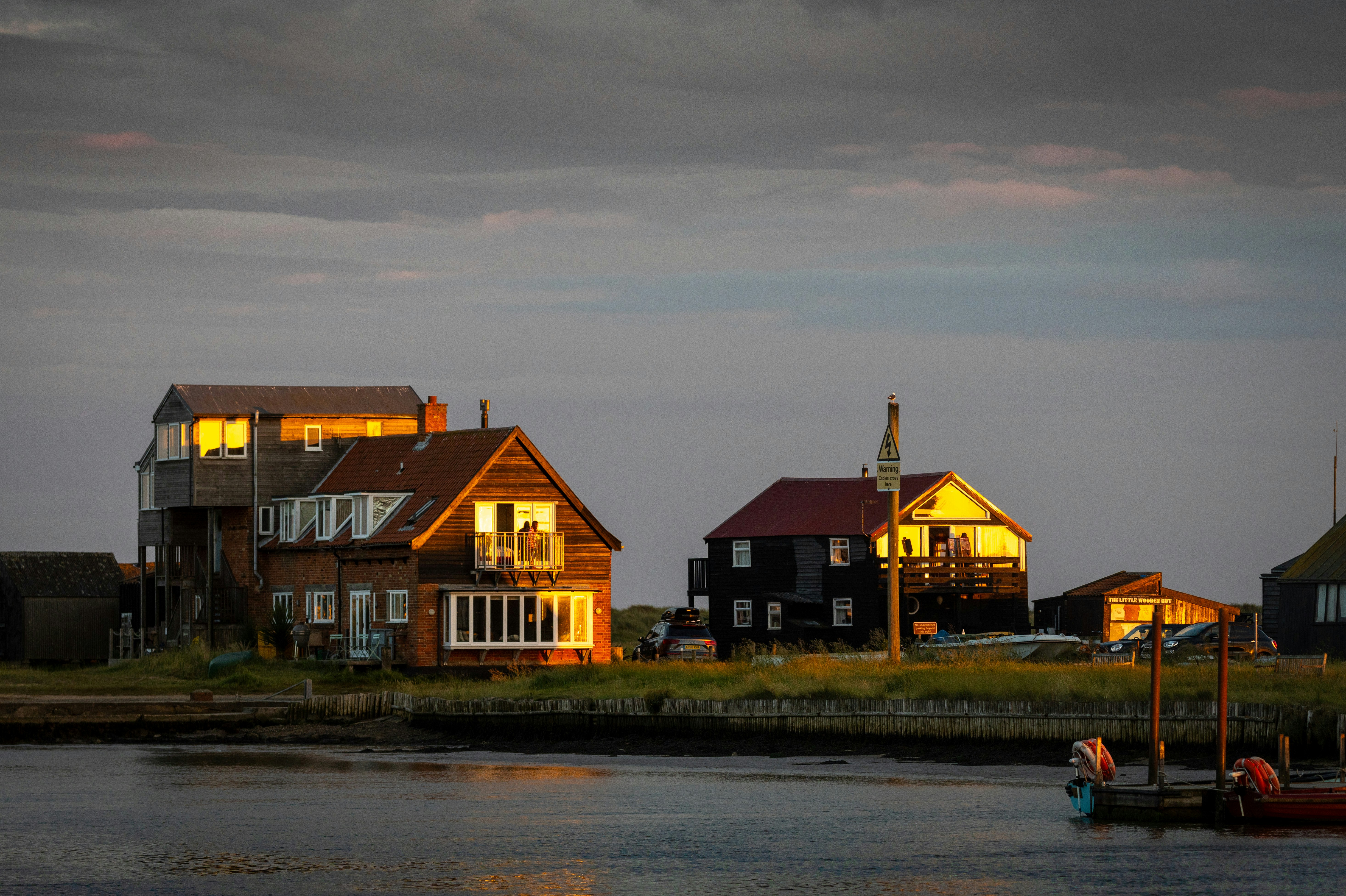 The Walberswick-Southwold ferry has stopped running for the night as the sun sets over the river Blyth.