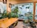 A stylish dining area with animal print accents and lush green plants for a fresh look.