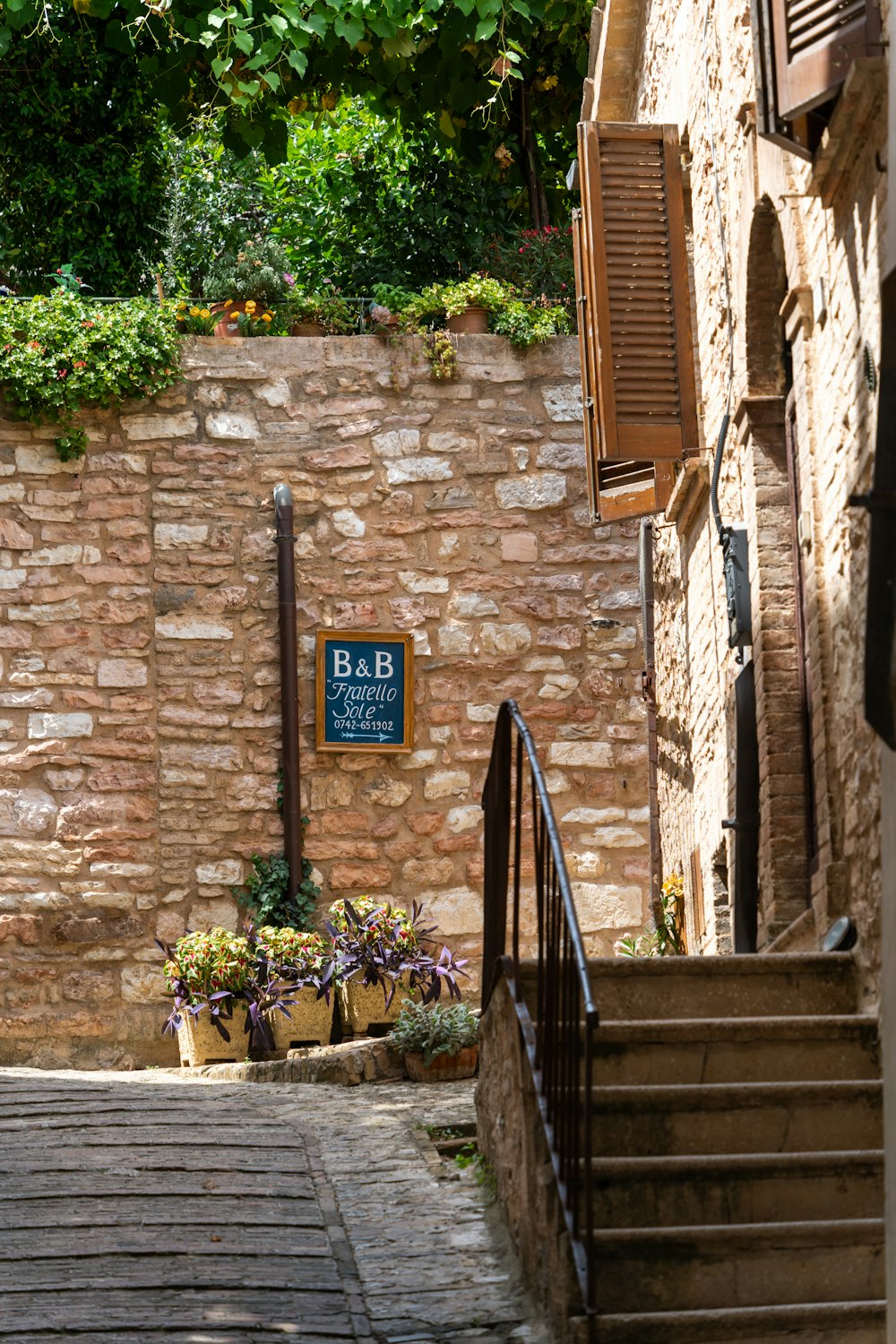 a stone building with a sign that says b b b