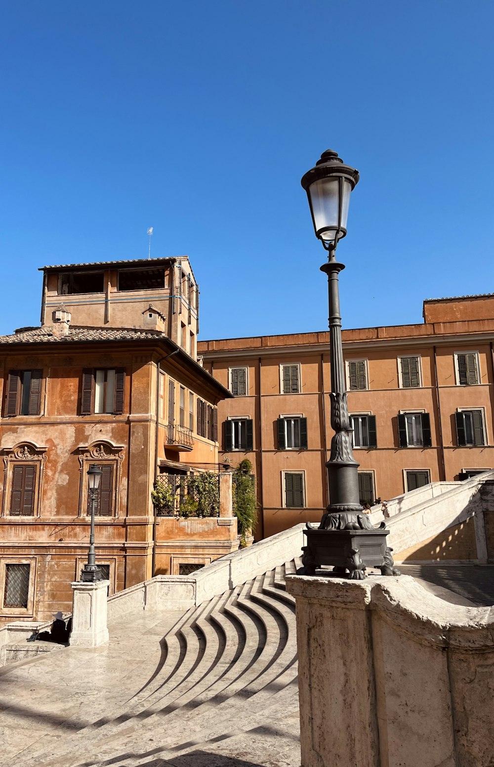 a street light sitting in front of a building