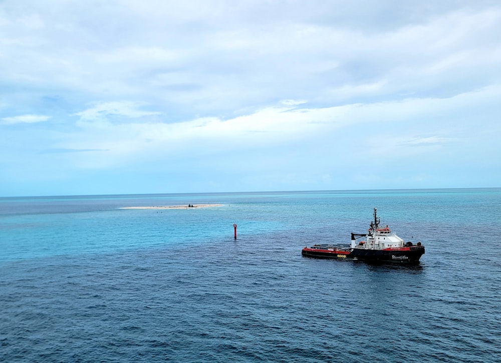 a large boat floating on top of a large body of water