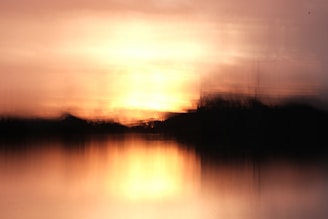 A softly blurred digital painting inspired by Monet’s Impression, Sunrise, showing light reflecting on water at dawn.
