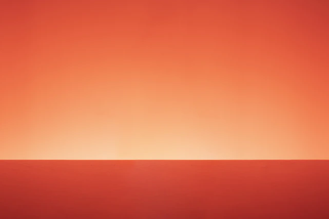 Minimalistic 'Coming Soon' sign against a soft gradient background