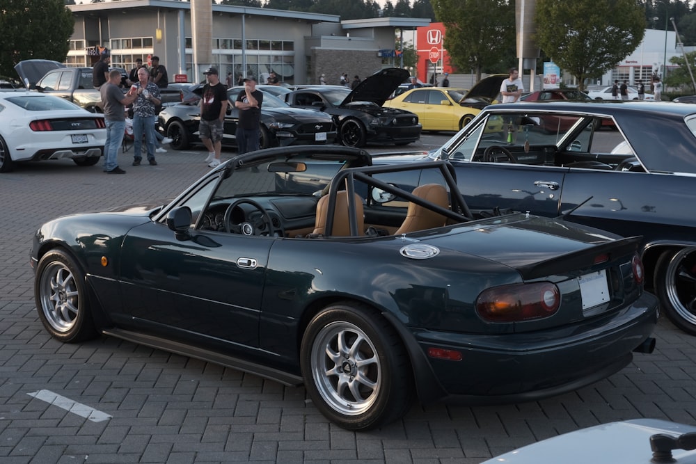 a group of cars parked next to each other in a parking lot