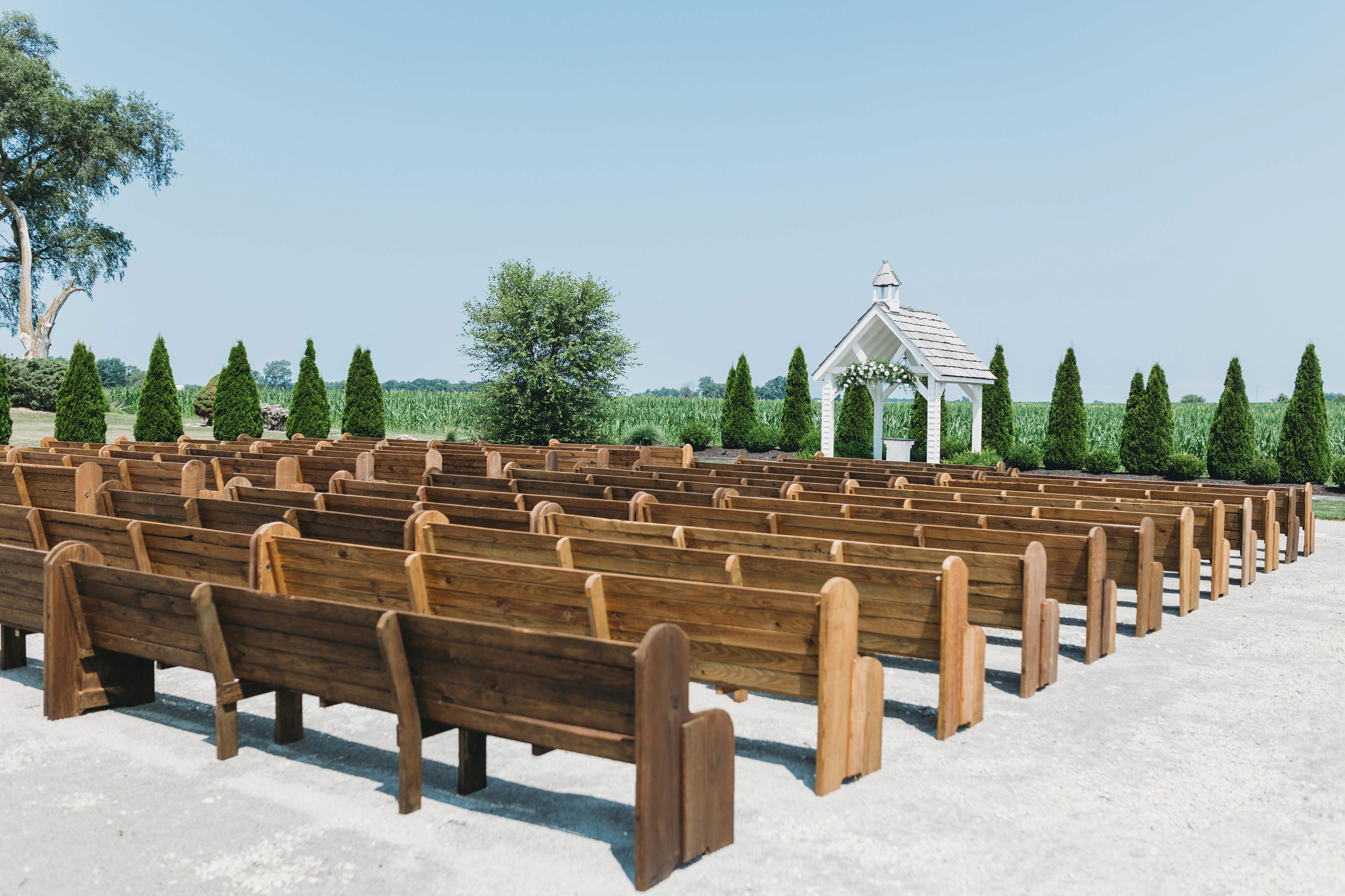 a row of wooden benches sitting next to each other