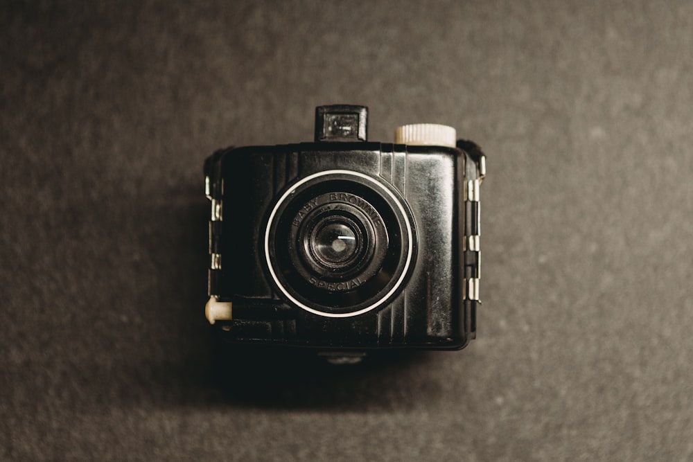 a black camera sitting on top of a table