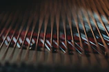 Artistic rendering of sound waves traveling smoothly from a restored piano soundboard.
