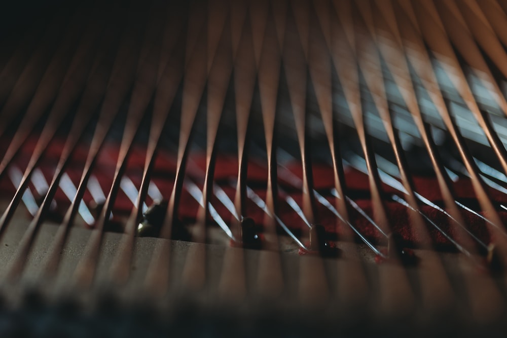 a close up of a piano strings with a blurry background
